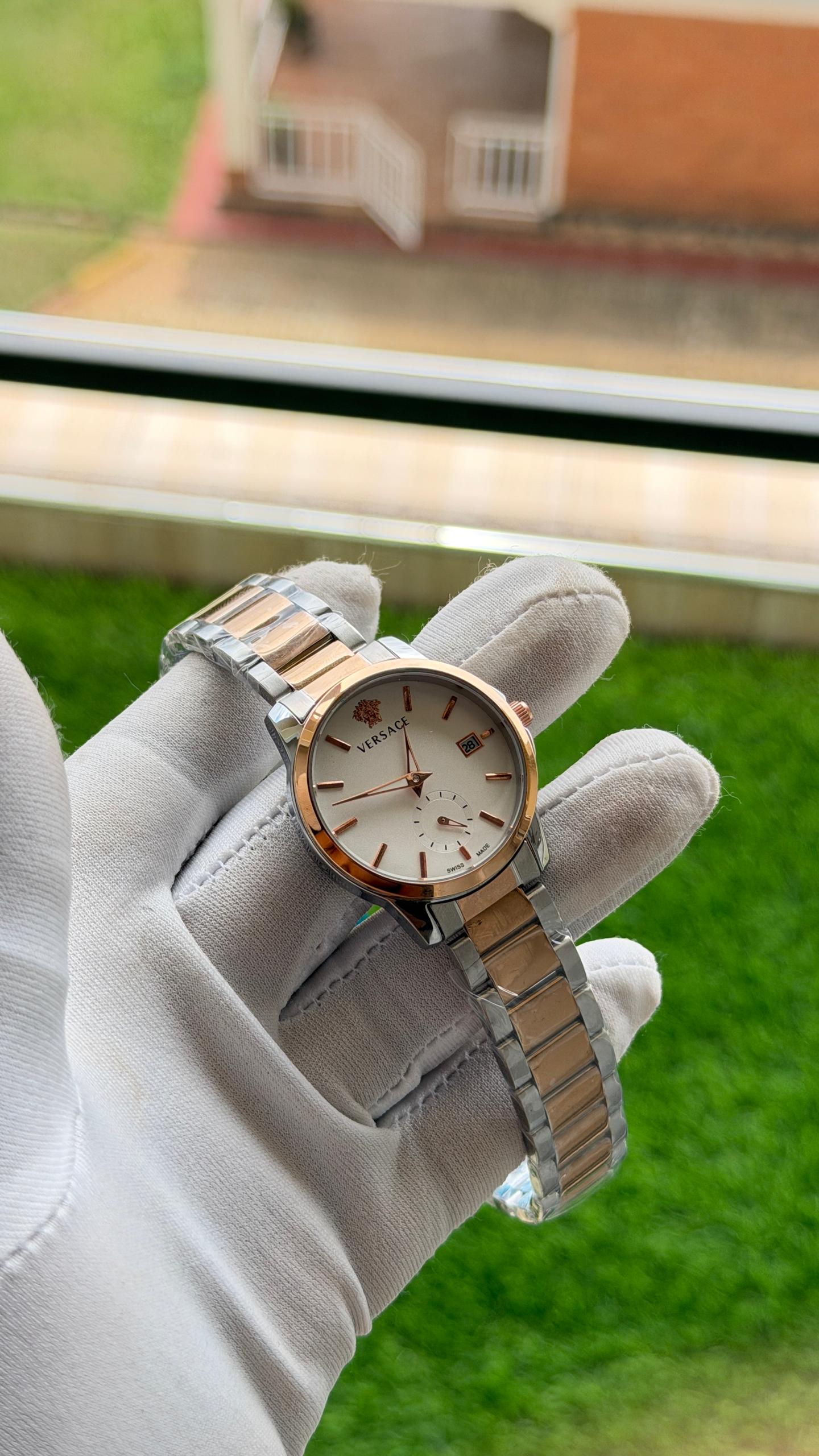 Elegant women's silver watch on a presentation cushion