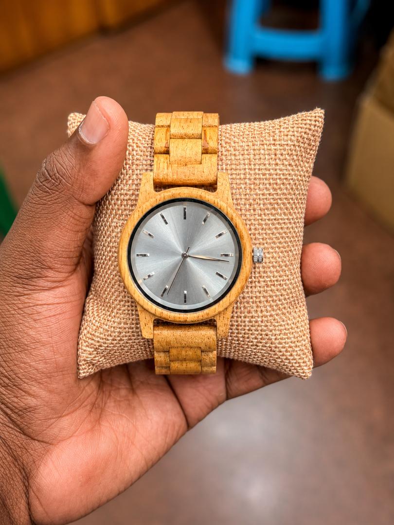 Natural wooden wristwatch with a clean white dial